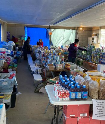 People pick out canned food and other essentials as autonomous mutual aid hub in Appalachia. 