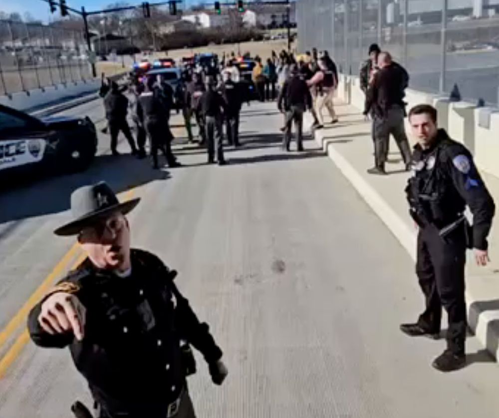 Police direct neo-Nazis to leave, as angry crowd pushes through police barricade. 