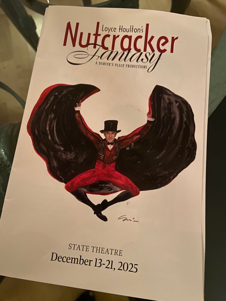 Playbill for Loyce Houlton’s Nutcracker Fantasy, A Dancer’ Place Productions. State Theater, Dec 13-21, 2025. White background with painting of godfather role in red with black top hat and cape. 