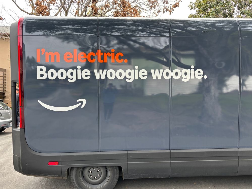 Amazon truck that says, "I'm electric. Boogie woogie woogie."
