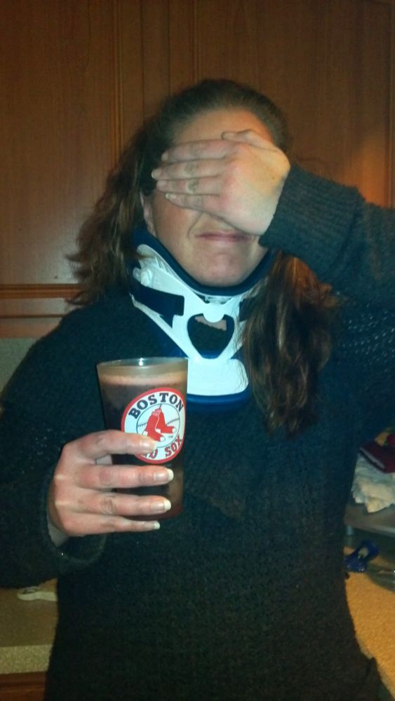 Megsy drinking beer from a Red Sox pint glass 