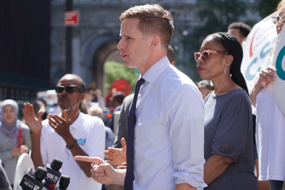 Councilmembers Rita Joseph and Erik Bottcher speak at a rally against public school cuts at the Tweed Courthouse. 