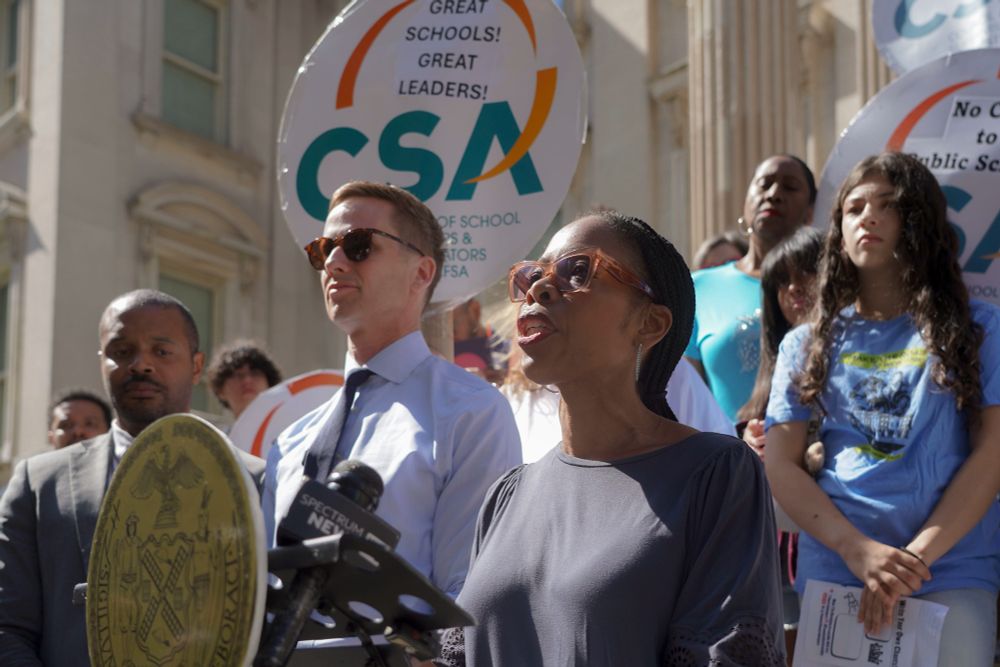 Councilmembers Rita Joseph and Erik Bottcher speak at a rally against public school cuts at the Tweed Courthouse. 