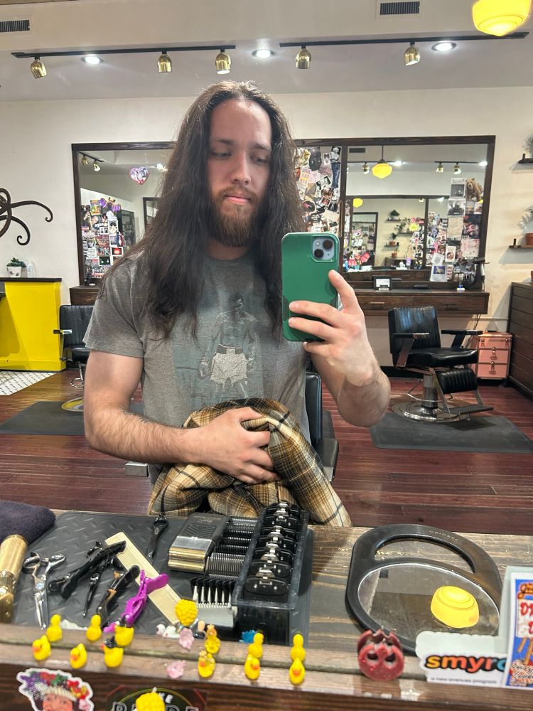 Post hair cut, same grey shirt. Beard now maybe an inch long and hair only down to my armpits. 