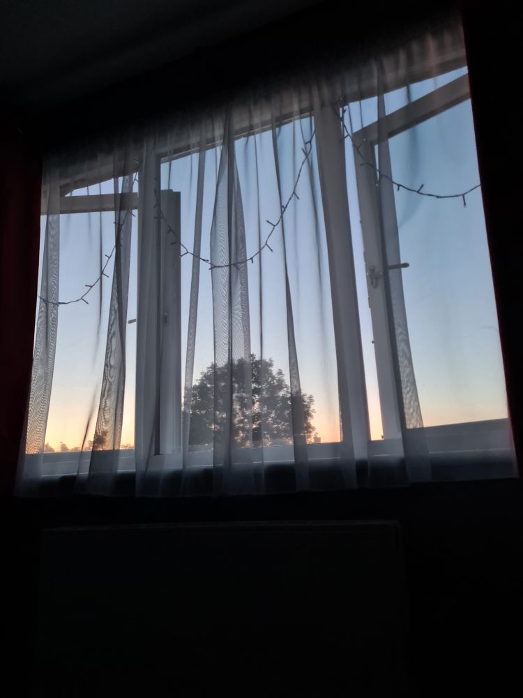 the light blue and orange sky at 9:53pm