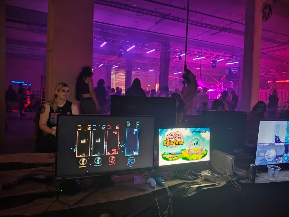 Gaming section (featuring Tetris) at a warehouse rave 