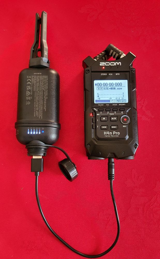 Zoom H4n pro Handy Recorder connected to a Nestout 10000 mAh power bank via a short USB to DC 4.0mm x 1.7mm 5v Power Cord.