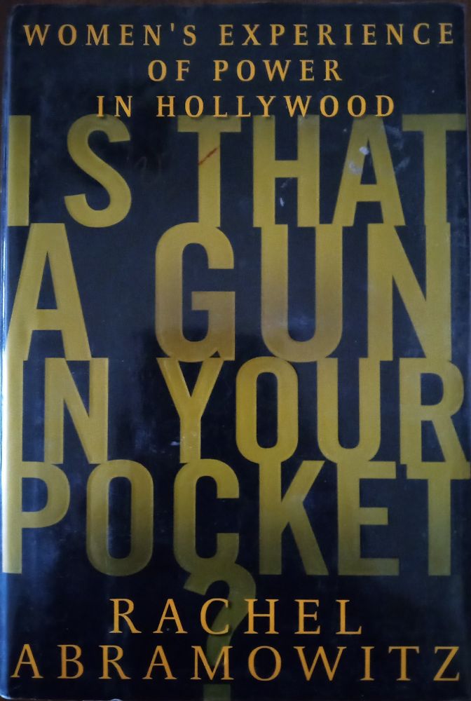 Photo shows cover of book "Is That a Gun in Your Pocket? Women's Experience of Power in Hollywood". Author is Rachel Abramowitz. Posting a book a day from female authors in honor of Women's History Month.