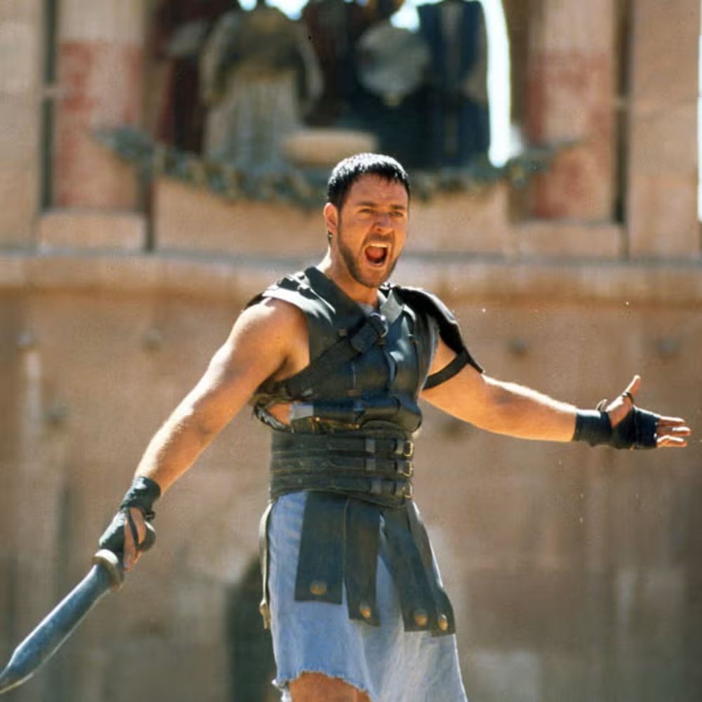 Gladiator pic, Maximus Decimus Meridius (played by Russell Crowe) defeats several enemies in a gladiator pit and dramatically exclaims “Are you not entertained?” before the audience