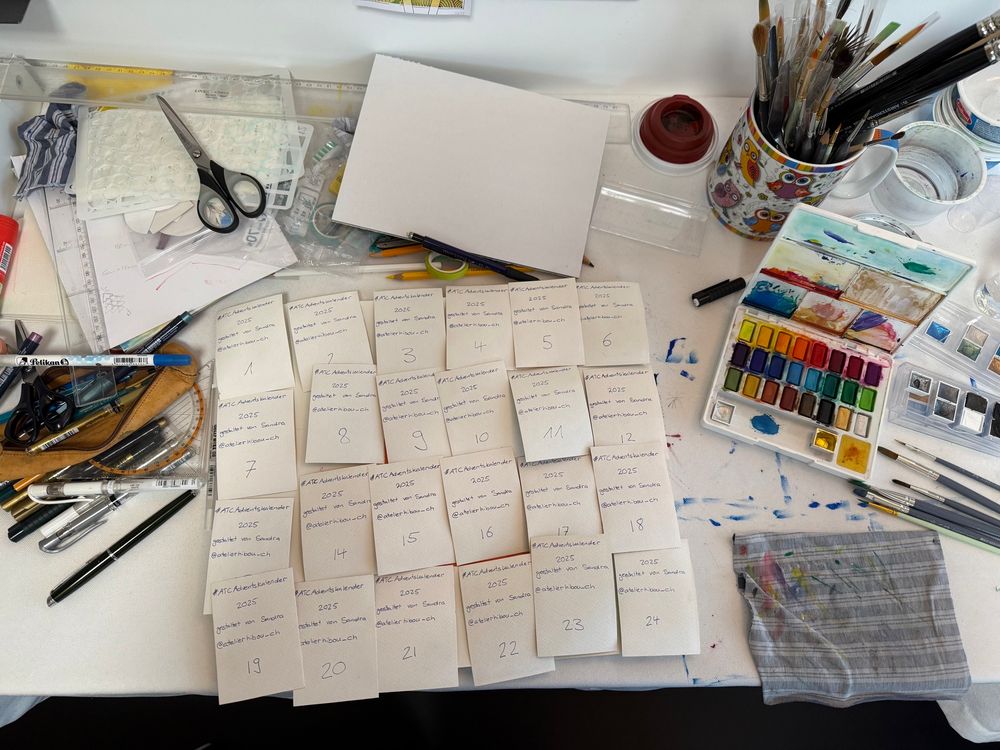 Picture of a table that is home to creative chaos