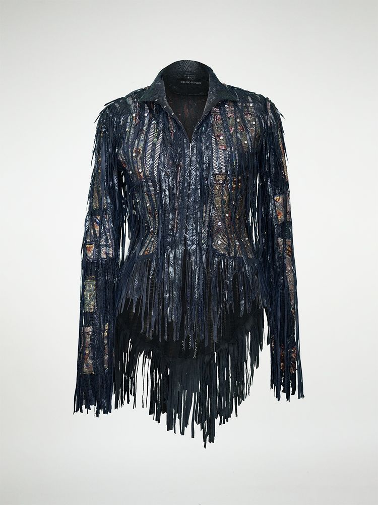 Jacket 1070 from the front. A mesh fitted jacket overlayed with strips of black leather, leather fringes, antique tapestry, and crystal rivets.