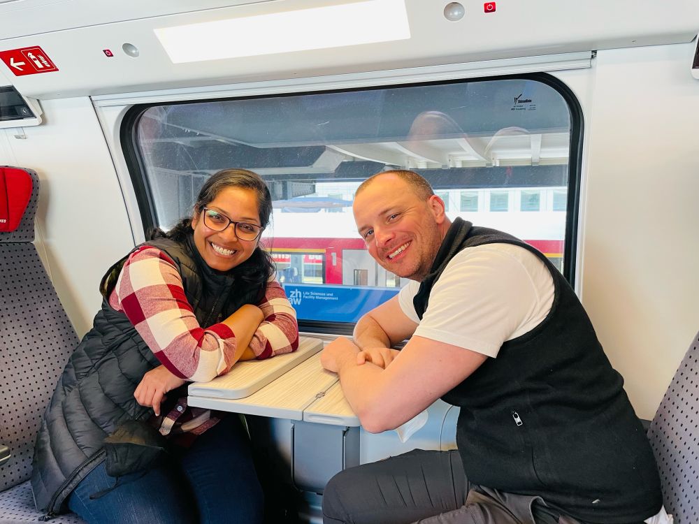 A photo of Roland and me sitting across from each other in a train