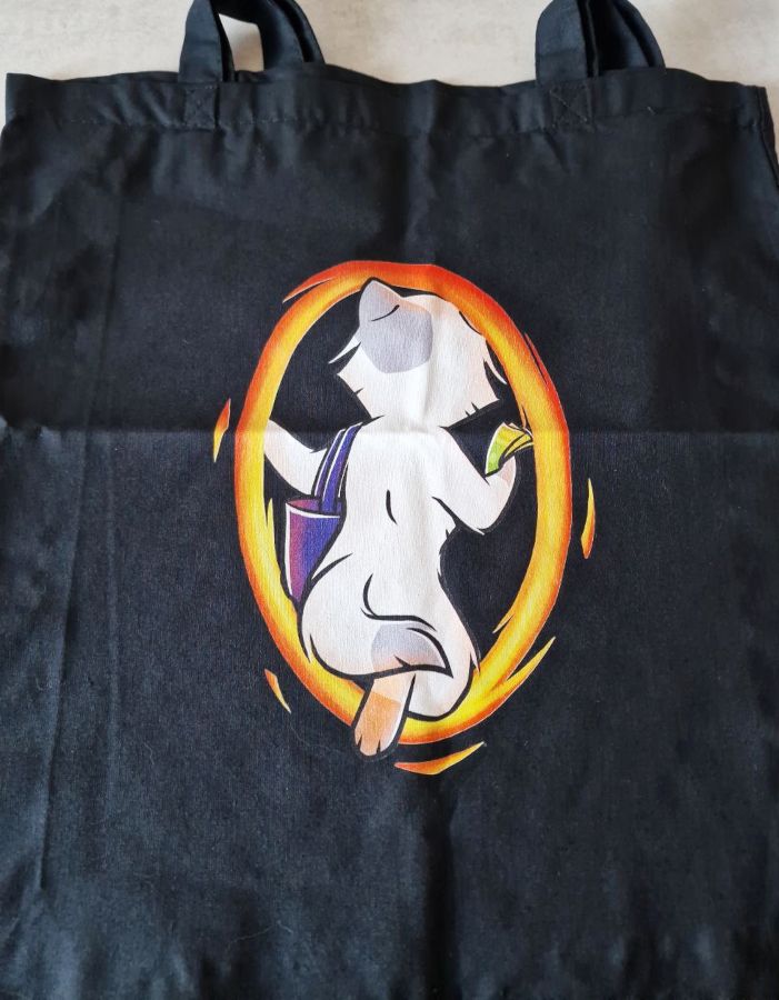 Black tote bag with a cat entering an orange portal with an empty tote bag and some money in its paw.