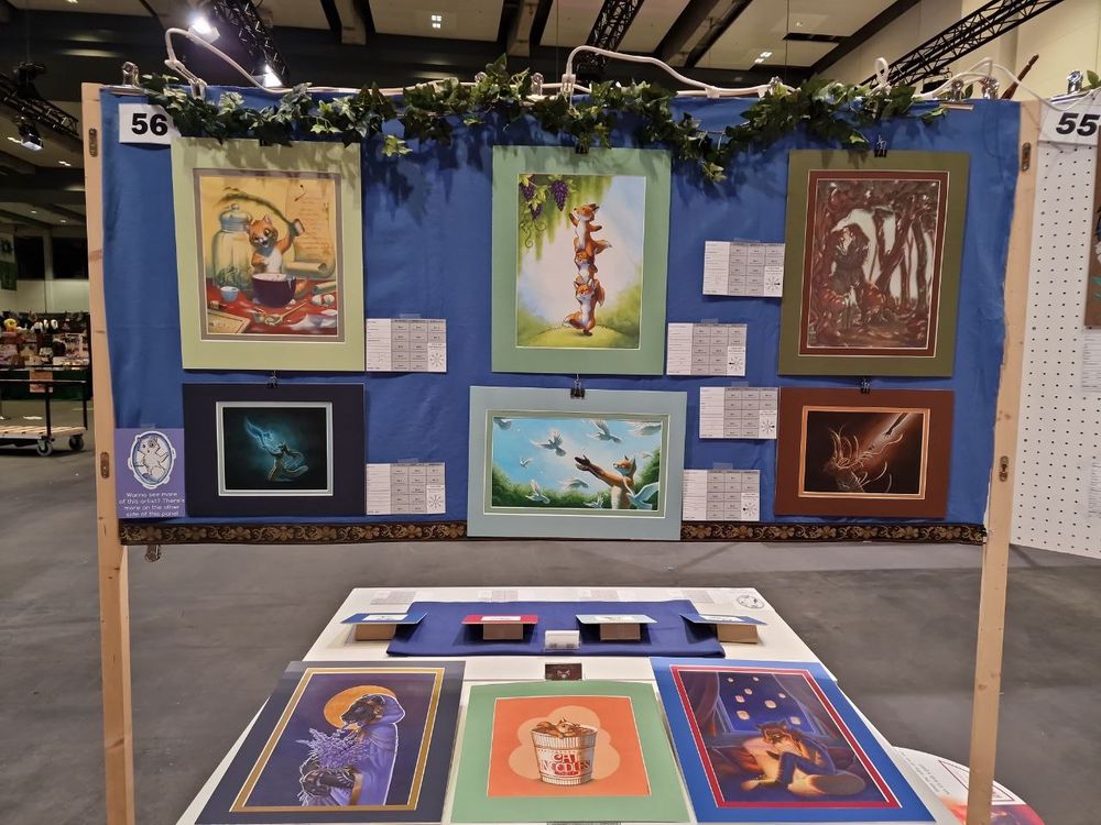 Picture of a completely set up and decorated Art Show panel by Pan.