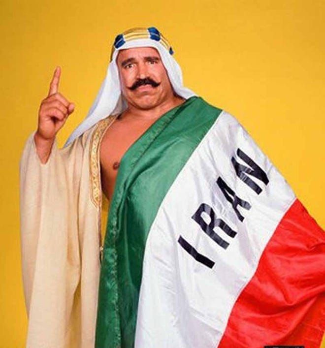 The Iron Sheik with the flag of Iran