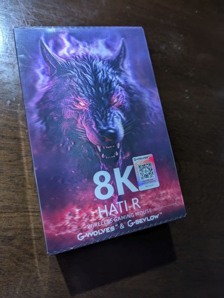 Holographic box for a computer mouse with an evil intimidating werewolf on the cover art