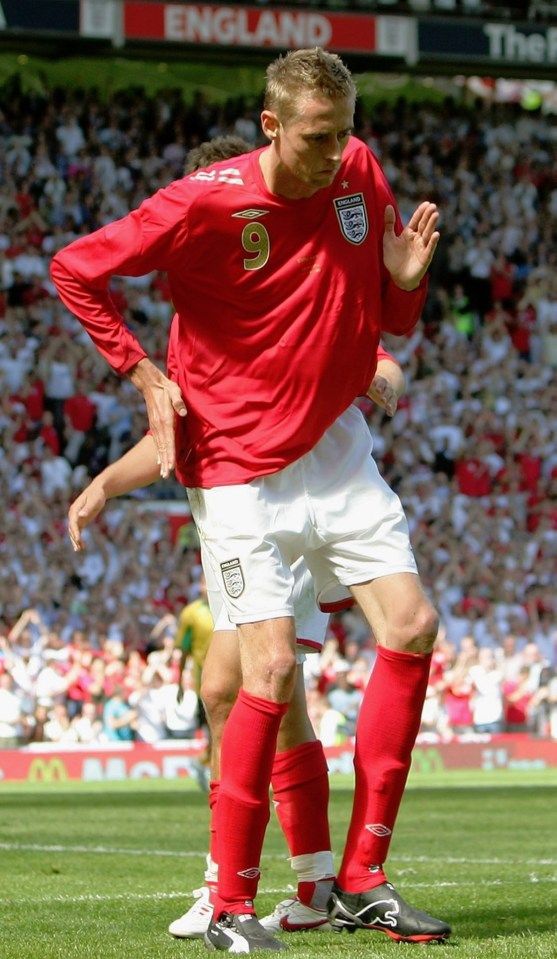 England footballer, Peter Crouch, performing his robot dance.