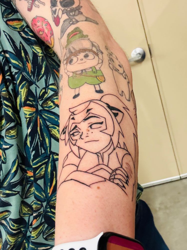 Tattoo on Cortland’s forearm of Catra from the show she-ra and the princesses of power