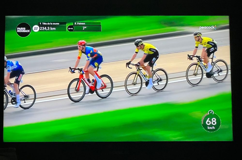 Four riders in the Paris roubaix cycling race from a tv broadcast
