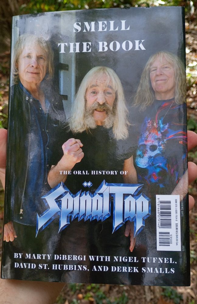Cover of Smell the Book: The Oral History of Spinal Tap, by Marty DiBergi with Nigel Tunnel, David St. Hubbins, and Derek Smalls.