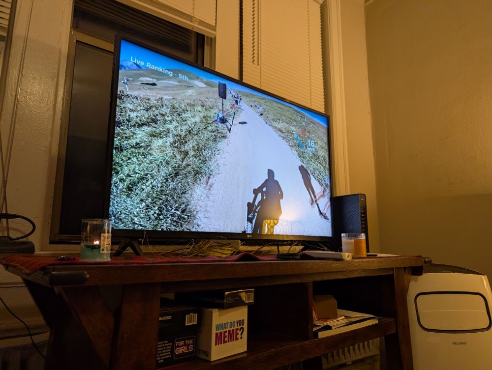 TV in my friend's apartment shows a guy biking in a downhill mountain race