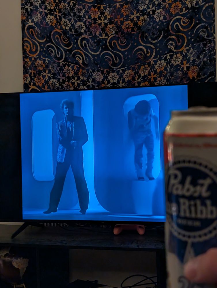 Zoomed in now, still holding a PBR, watching the Out of Touch music video by Hall and Oates 