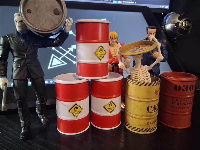 An assortment of 1/12 scale figures with 1/12 scaled industrial barrels. 