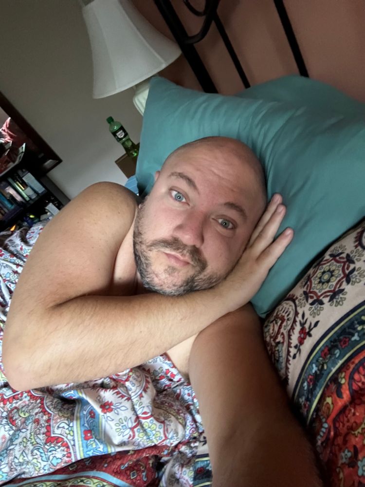 Me snuggled in bed not wanting to leave bed. 