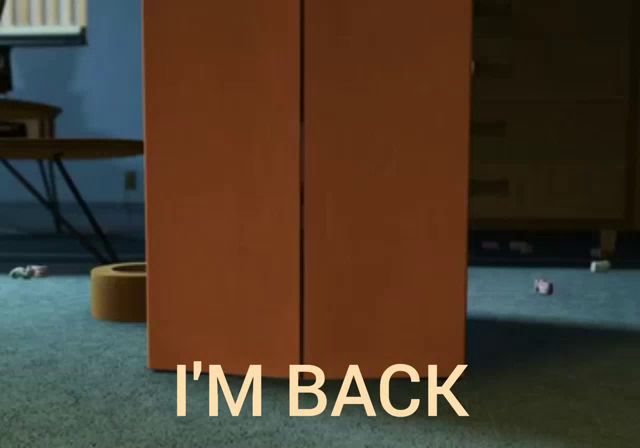 woody from toy story is peeking out from behind a cardboard box that says i 'm back