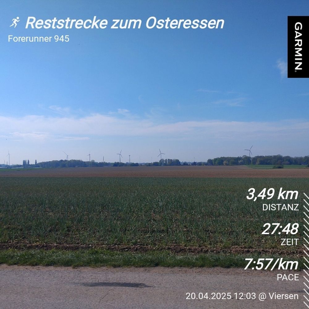 Garmin Laufergebnis "Reststrecke zum Osteressen" 3,49 km in 27 Minuten und 48 Sekunden auf einem Foto mit dem Blick über ein weites Feld 