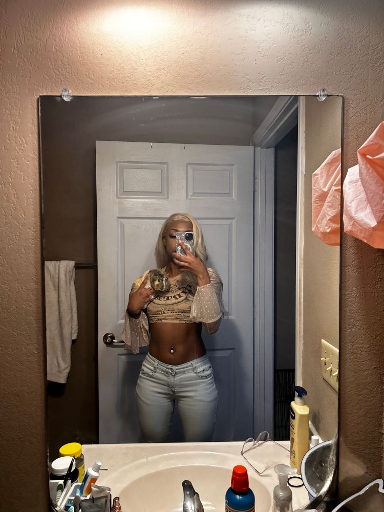 User standing in bathroom (serving bawdy {subjective})holding guinea pig