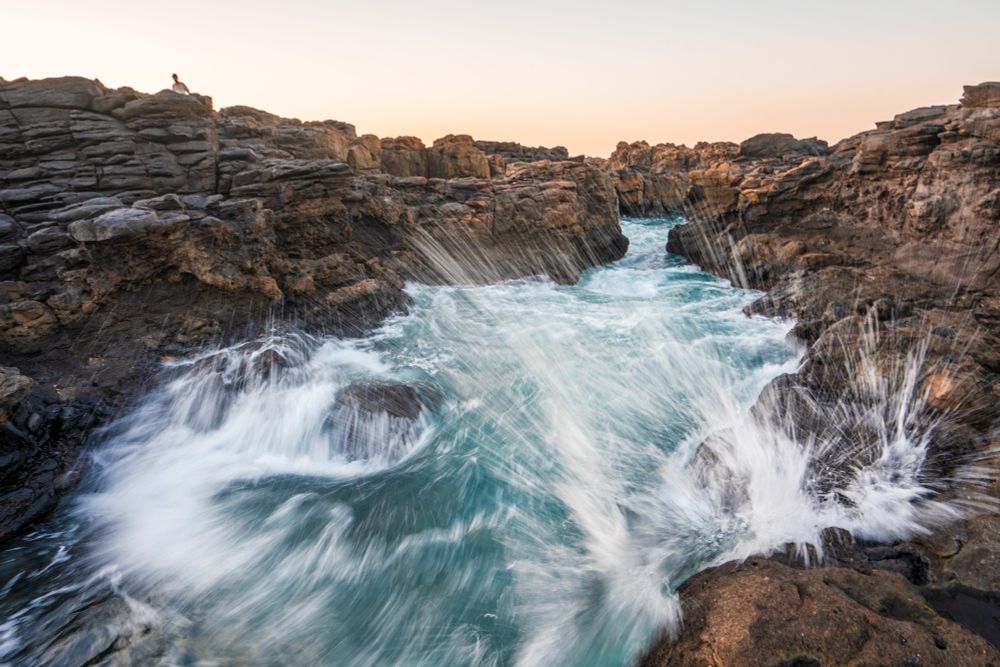 Small splashes of waves over rocks