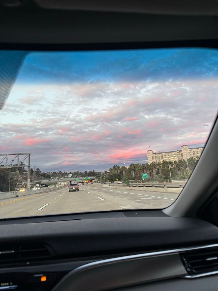 Skyline with pink & purple clouds.