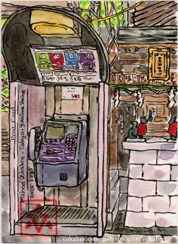 Vertical painting in watercolour with ink lines. On the right is a small shrine with guardian fox figurines. On the left is a street phone. The shrine stands on a stone pedestal, with Japanese style roof above. The phone has a piece of paper above it describing emergency number, and is illuminated by faint light. Behind the phone is the mess of wires going to different places to the top, left, and the right. The postcard is signed Michael Vokabre Tokyo Yushima Shrine 2025 5785, and on the bottom left is the artist's stamp.
