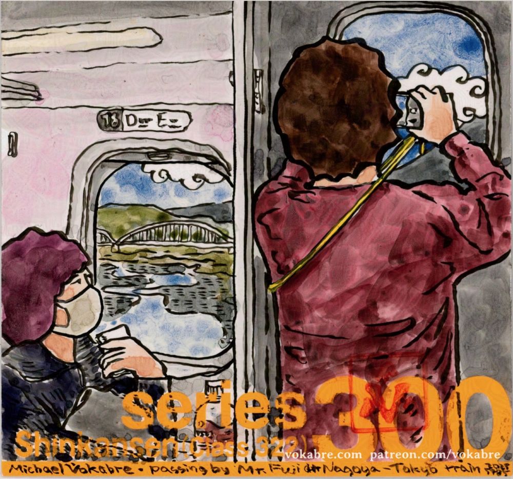 Square painting made in watercolour with ink lines. It roughly consists of two halves. On the left is the inside of the cabin of the passenger trains, on the right is the area near the door. On the left sits a woman in a face mask, holding a phone in her hand, and looking to the window, behind which is half-dried river, greenish hills and a bridge. Above the window is the plaque 18D E. On the right stands a woman with a camera or a phone attached to a through-shoulder strap. In front of her is a bit of Mt. Fuji with a fluffy cloud above. Below is a print "Series 300 Shinkansen class 322" and an artist signature "Michael Vokabre Passing By Mt. Fuji on Nagoya - Tokyo Train 2025 5785" and with an artist's stamp.
