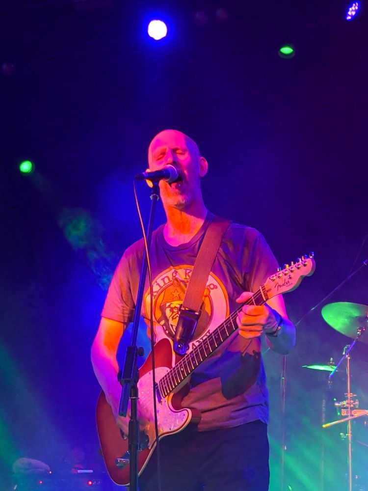 Nigel Blackwell singing with Fender guitar