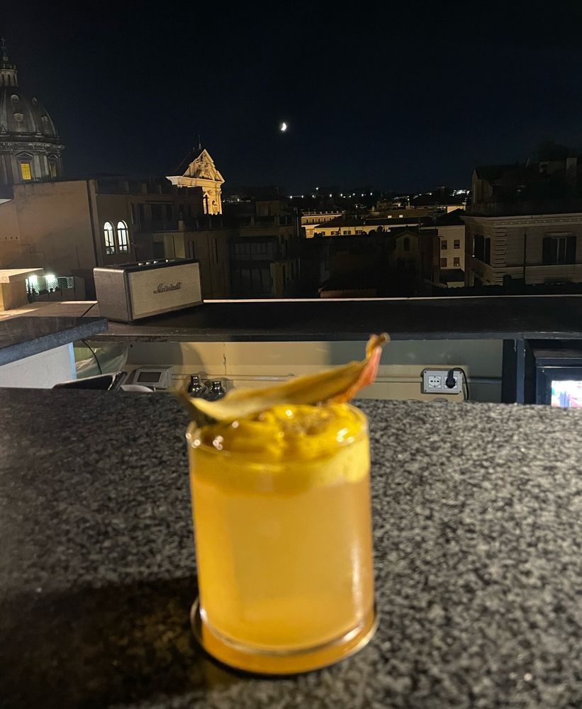 Cocktail on a rooftop bar overlooking the Pantheon in Rome