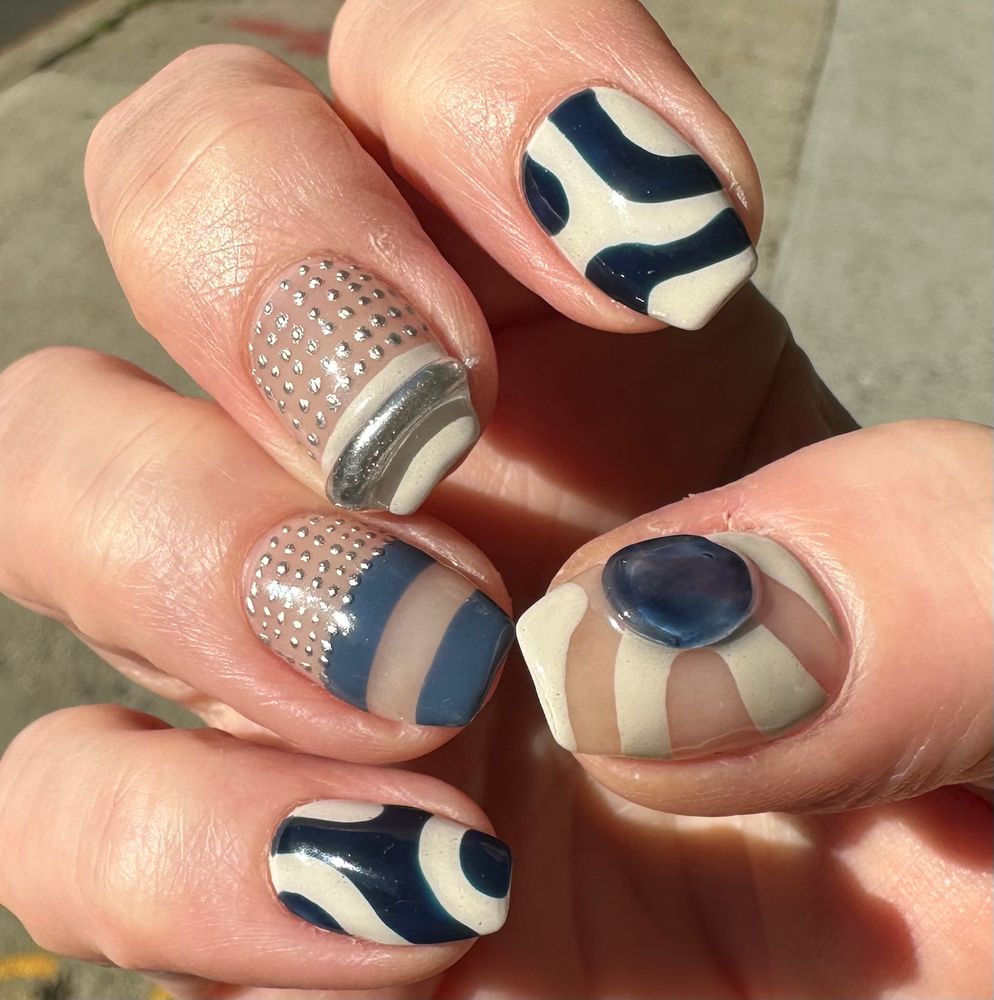 graphic blue, cream and silver manicure design 