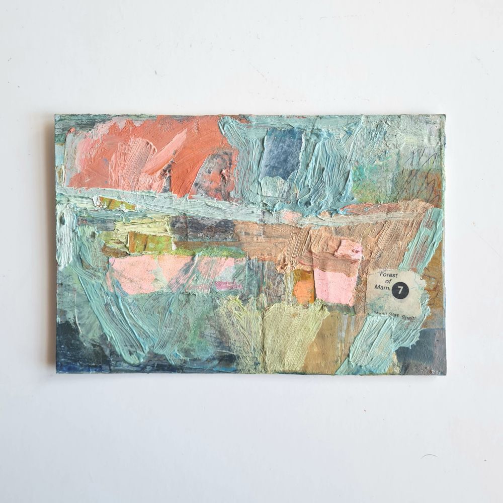 Postcard-sized abstract landscape painting on heavy card, with richly textured paintwork and paper collage elements. Mainly painted in pale blue/green and peachy orange colours. The painting sits against a white background. 