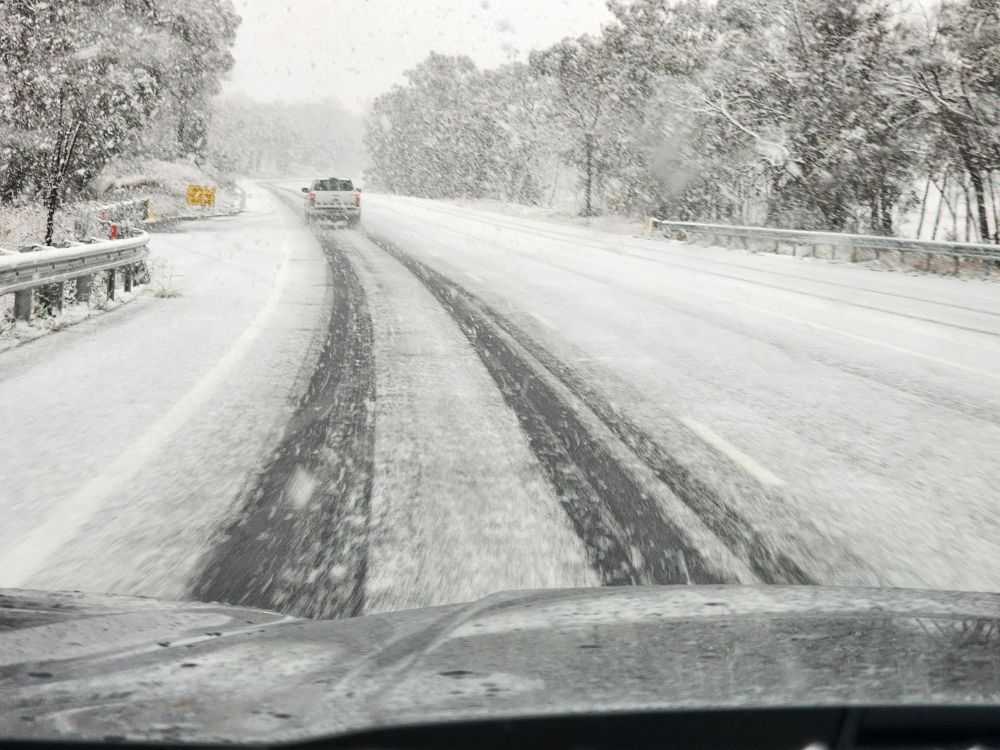 Snow beginning to settle on the road north of Bendemeer