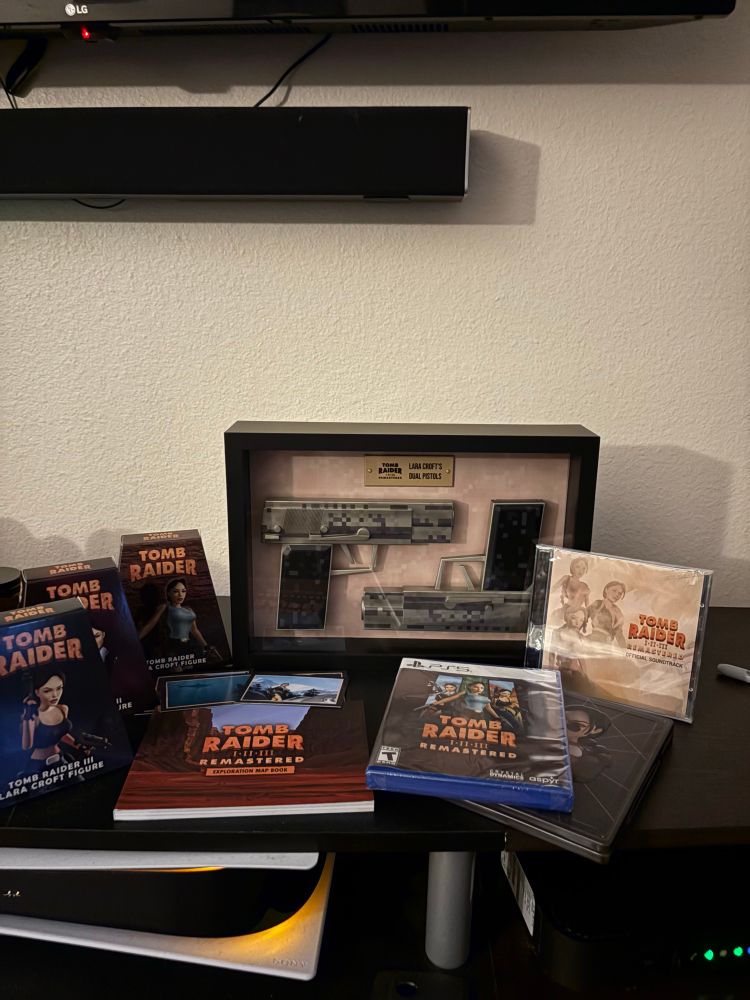 An assortment of tomb raider goodies from the collector’s edition 