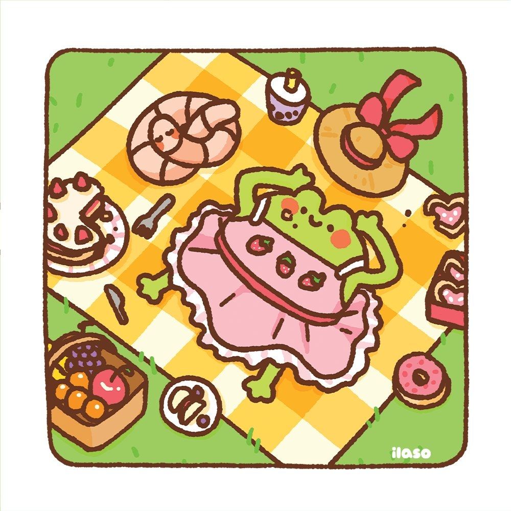 Tom the Frog and Olivia the Worm lying on a picnic blanket on grass with various strawberry-themed food surrounding them