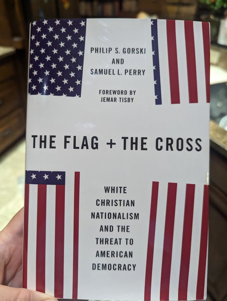 Book cover of "The Flag + The Cross: White Christian Nationalism and the Threat to American Democracy" by Philip S. Gorski and Samuel L. Perry