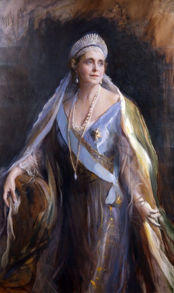 Queen Marie of Romania in a 1936 portrait by Philip de László. The 60-year-old Queen is regal in a robe of lilac sating with floating gauze overlay, sleeves, and veil. She wears a large fringe tiara and ropes of pearls.

She was, it must be admitted, a terrible showoff, but she had the power of absolute self-regard, which can get one a very long way.
