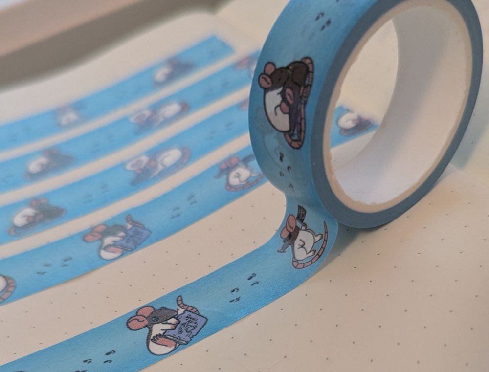 A photograph of some washi tapes featuring rats on a blue background