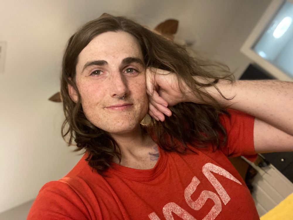 A cute gay woman looking into the camera gayly. 