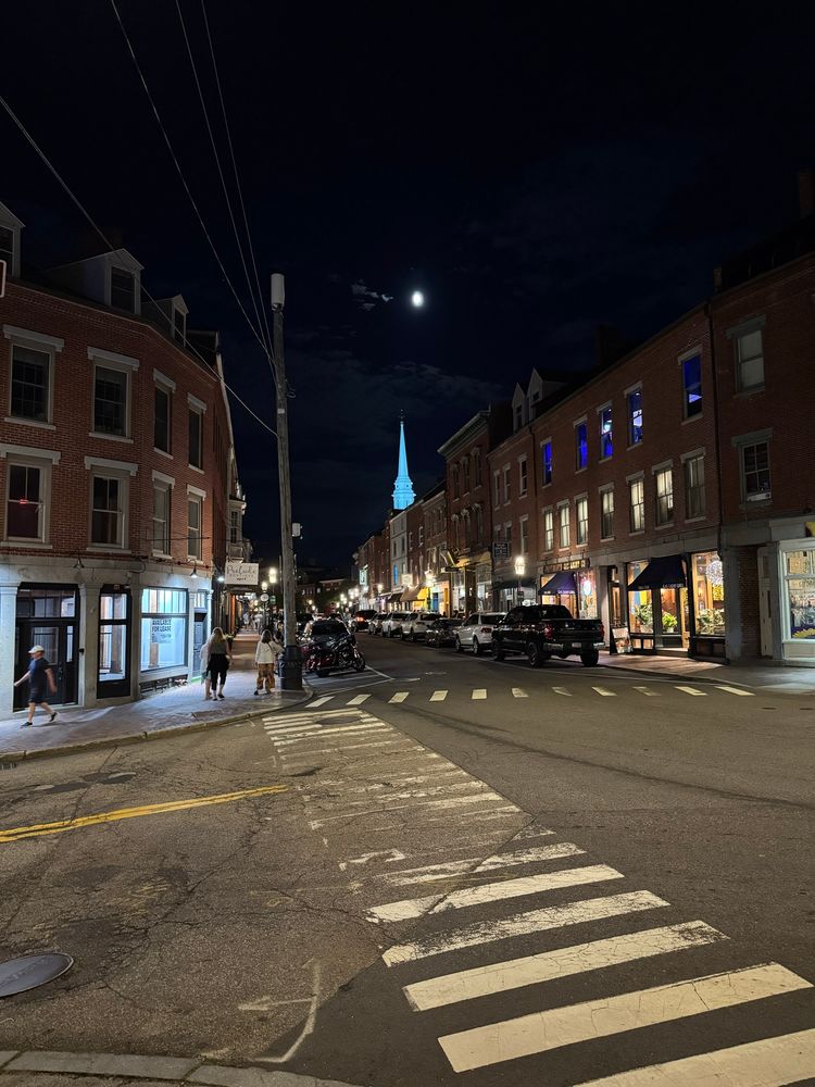 A view of the moon over a church spire from the Main Street in Portsmouth, NH