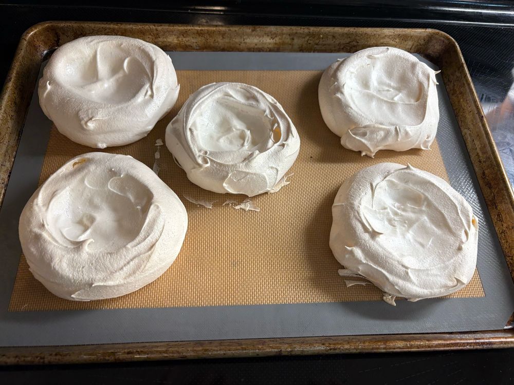 Pavlova shells, awaiting whipped cream and raspberries. Thinking about adding some single malt Scotch to give it a crannachan vibe