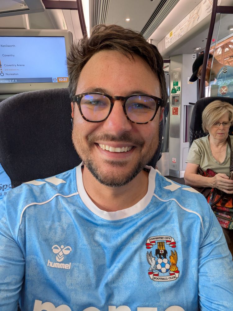Me on a train in a Coventry City top