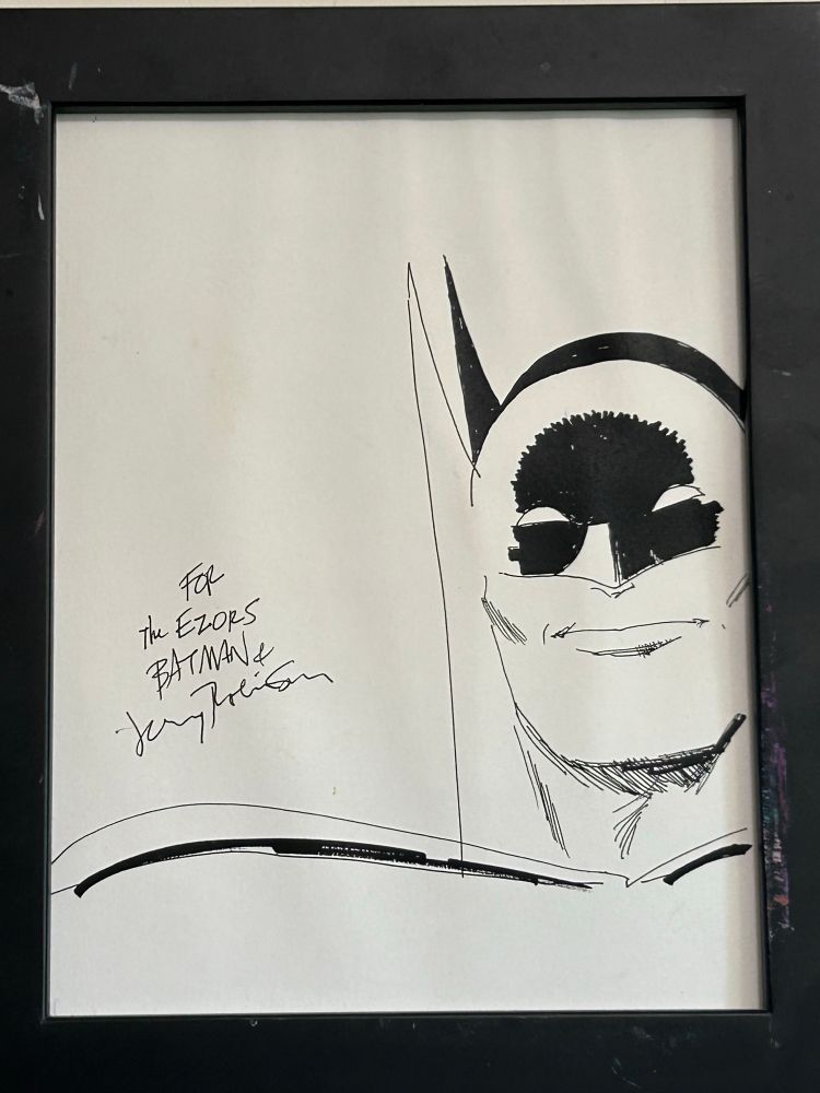 A line drawing of Batman, autographed by early Batman co-artist Jerry Robinson to the Ezors